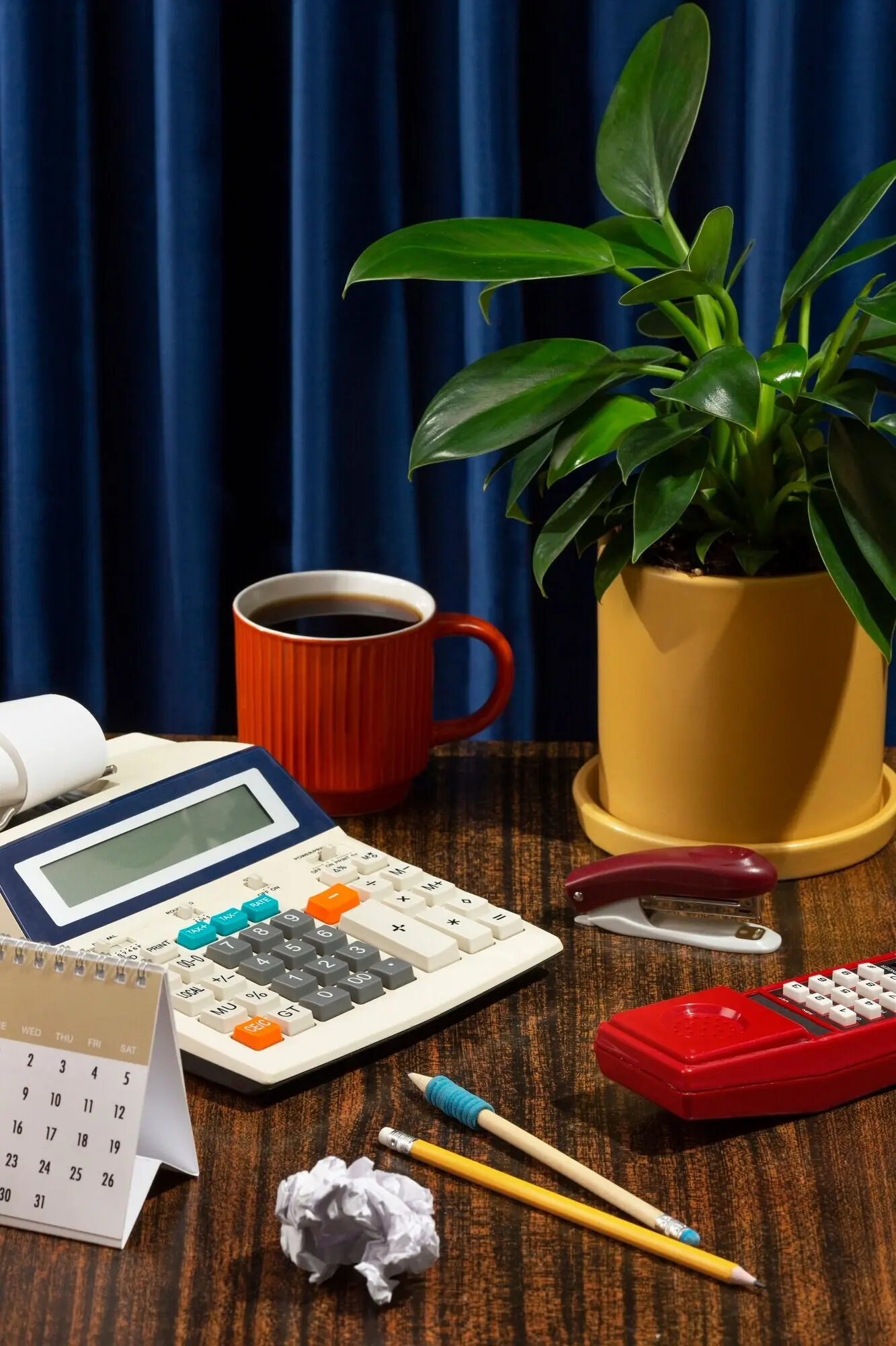 Still life depicting a cluttered office desk